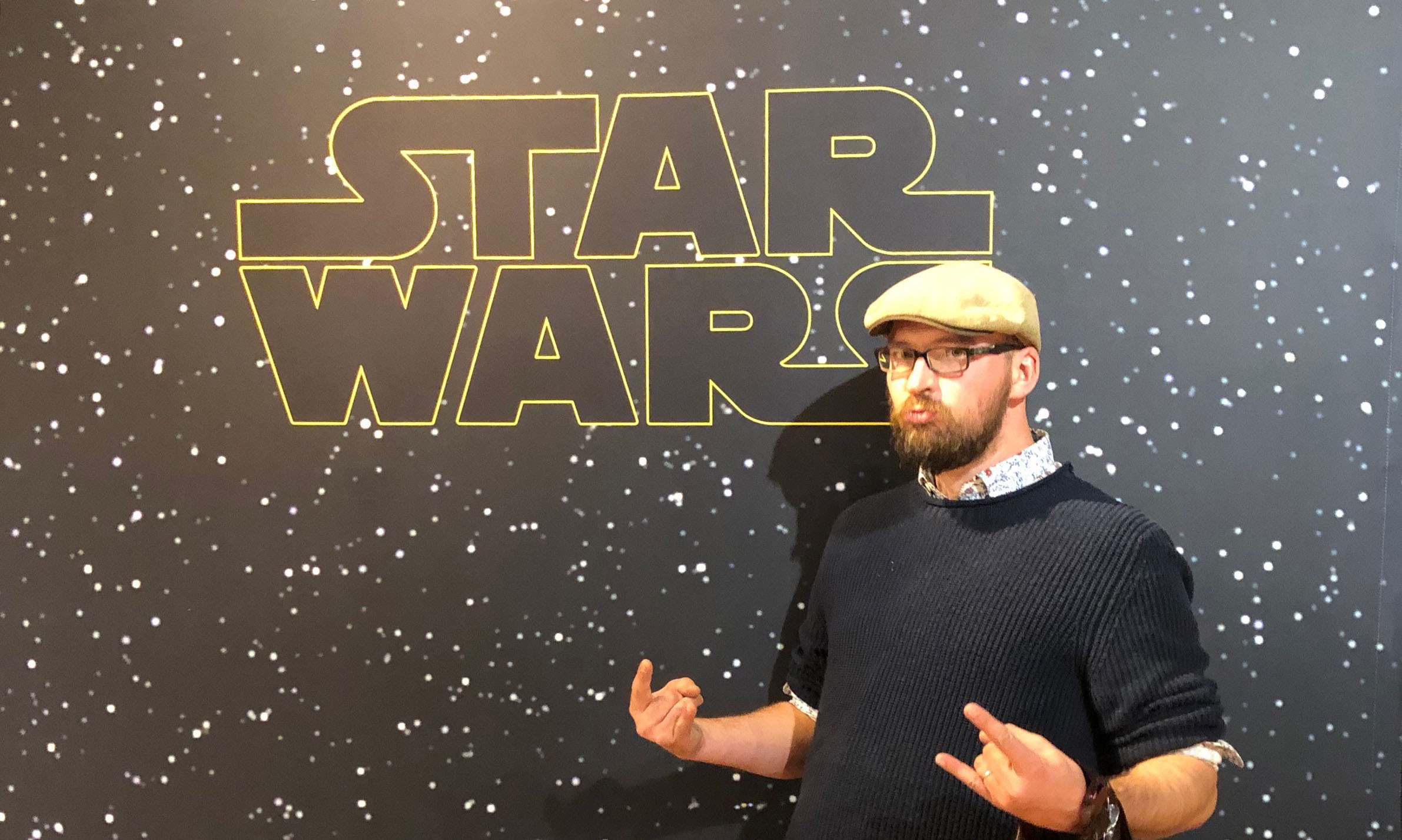 Carey in front of a Storm Trooper replica